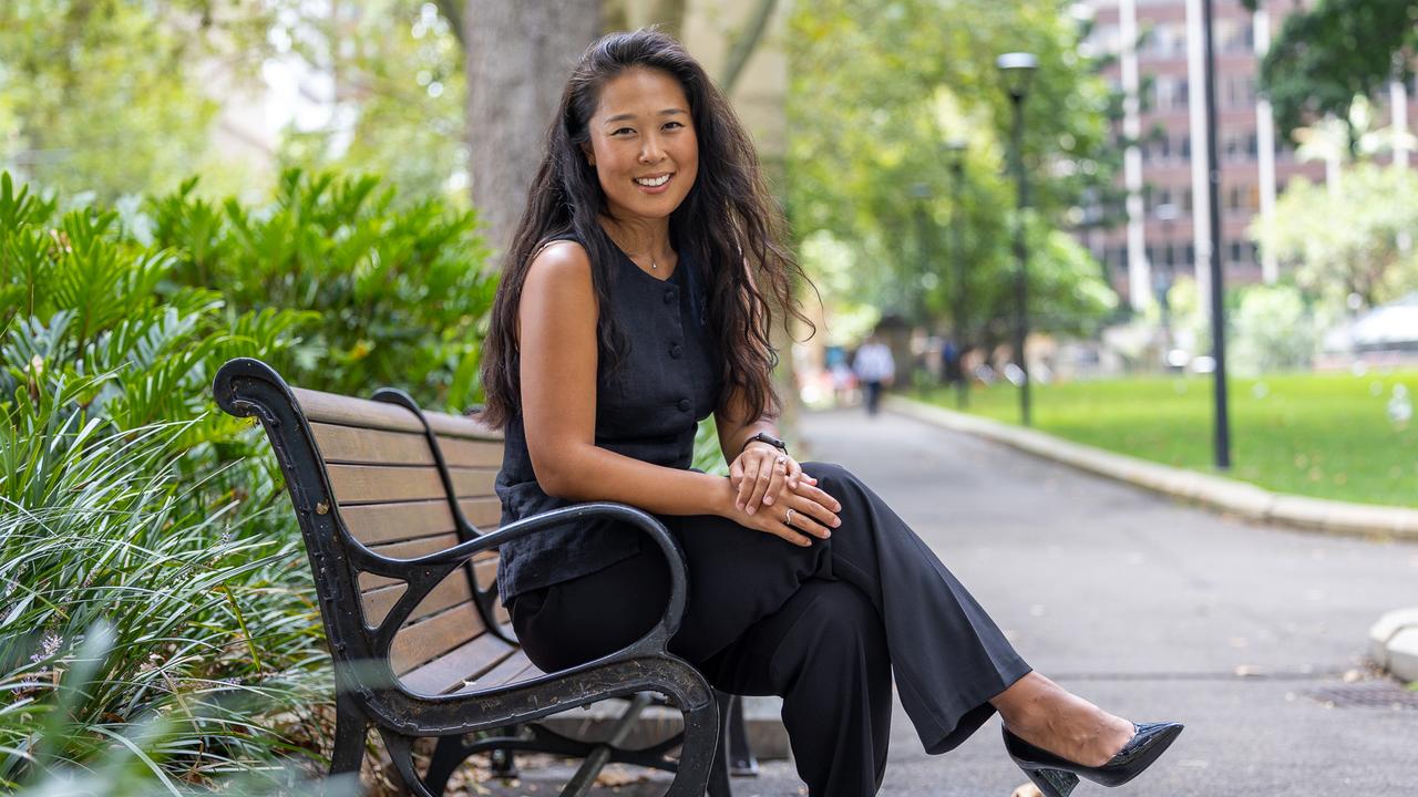 Julie Song commutes to the city each day for work from Newcastle so that she can keep her beach lifestyle. Picture Thomas Lisson