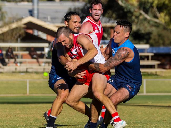 Rovers pair Cameron Ilett, left and Luke Farrow, right, combine to stop Federal's Abe Ankers running away with the football. Picture: Charlie Lowson