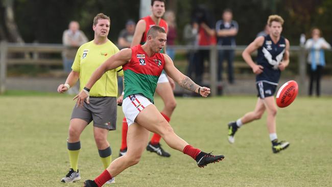 Pines player Lachlan Pizzey boots the Pythons into attack against Edi-Asp on Saturday. Picture: Chris Eastman