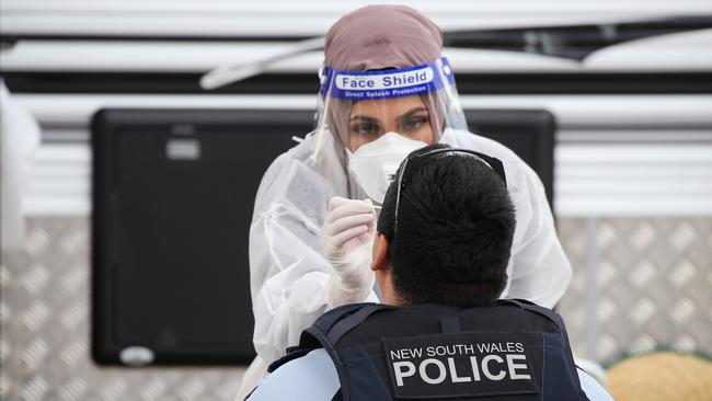 Essential workers were seen lining up to get tested for Covid at Sydney International Airport. Picture: NCA NewsWire / Gaye Gerard