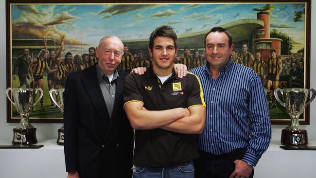 How it began: Josh Kennedy (middle), son of four-time premiership player John Kennedy jnr and grandson of three-time premiership coach John Kennedy snr, ahead of him joining the Hawks as a father-son selection in 2006.