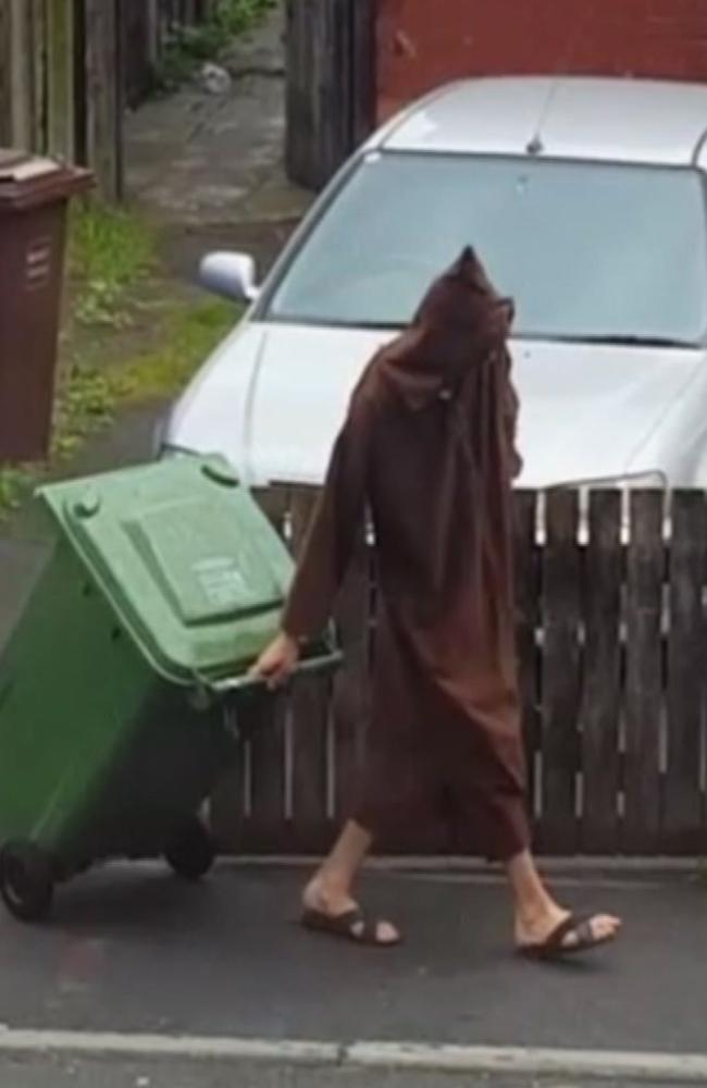 A man believed to be the Manchester bomber pulls a bin outside his home. Picture: Sky News Exclusive via AP