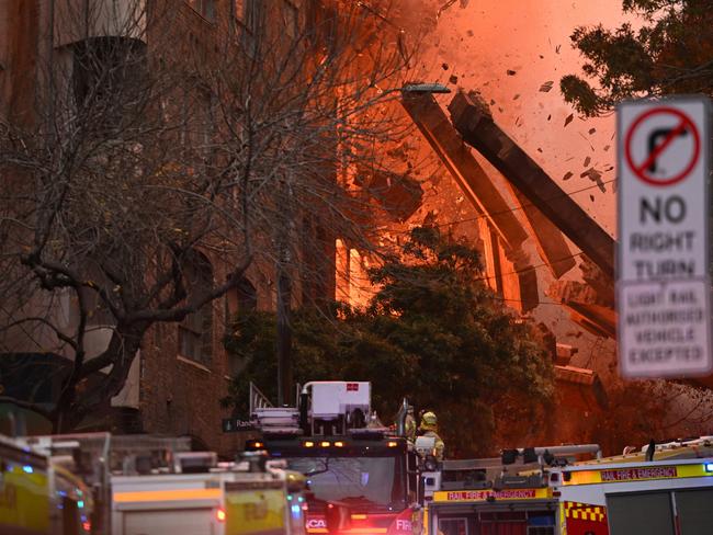 Huge chunks of the wall fall to the street. Picture: AAP