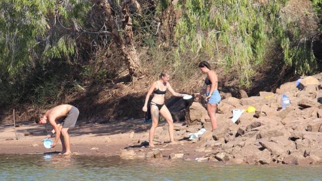 People washing their dishes in the Victoria River only metres from where a 4.38m saltie was caught