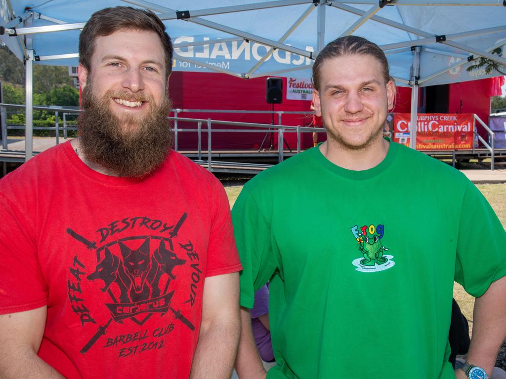 (From left) Eating contest entrants Andrew Henry and Tim Zuyderwyk at the Murphys Creek Chilli and Craft carnival. Sunday, September 22, 2024. Picture: Nev Madsen