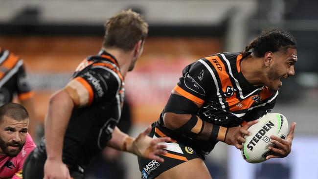 SYDNEY, AUSTRALIA - JULY 04: Thomas Mikaele of the Tigers is tackled during the round eight NRL match between the Wests Tigers and the Penrith Panthers at Bankwest Stadium on July 04, 2020 in Sydney, Australia. (Photo by Mark Kolbe/Getty Images)