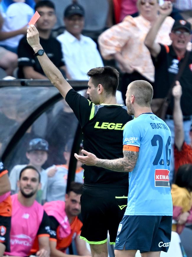 Sydney FC captain Luke Brattan can’t believe it as referee Jonathan Barreiro sends off Paulo Retre. Picture: Bradley Kanaris/Getty Images