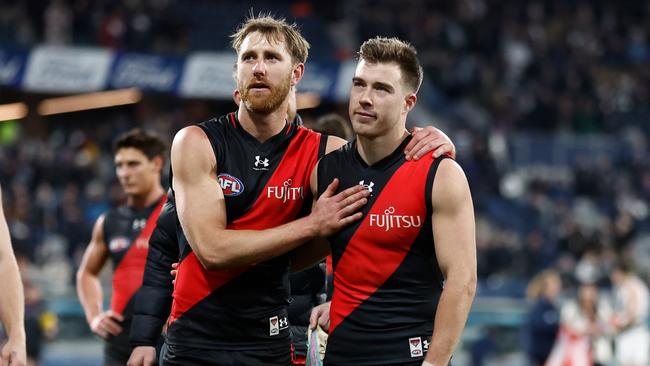 Dyson Heppell (left) alongside current Bombers captain Zach Merrett. The former skipper Heppell is a chance to play his 250th game this season. (Photo by Michael Willson/AFL Photos via Getty Images)