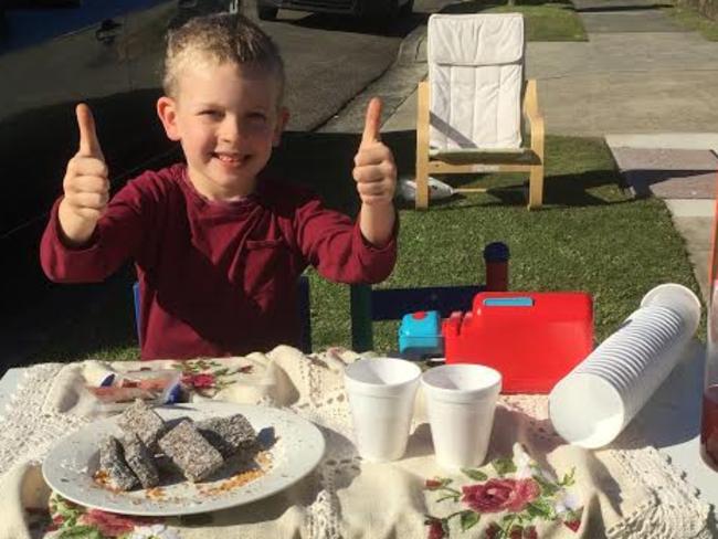 It was thumns up for little Max Clayton, who set up this tea and lamington stand in front of his house, next to the Horner Memorial Uniting Church polling booth.