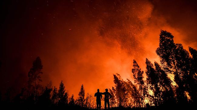 Firefighters at a blaze in Amendoa in Macao, central Portugal. The IPCC has medium confidence that the frequency of extreme fire weather days has increased. Picture: AFP