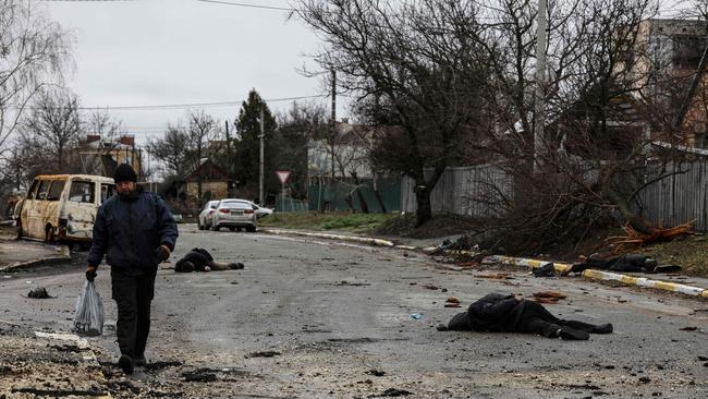 e horrors of war have become so routine in Bucha that the remaining residents walk down the street past the bodies, barely casting a glance. Picture: AFP