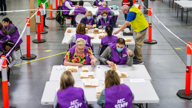 MELBOURNE, AUSTRALIA - OCTOBER 14:  AEC staff count votes at a vote counting centre on October 14, 2023 in Melbourne, Australia. A referendum for Australians to decide on an indigenous voice to parliament was held on October 14, 2023 and compelled all Australians to vote by law. Early voting began on Oct. 2, and activity has been intensifying in both the YES and NO camps, with multiple polls showing the YES campaign headed for defeat nationally. Australia requires a "double majority" of both the states and voters across the country to trigger constitutional changes, with most referendums in the past having failed. (Photo by Asanka Ratnayake/Getty Images)