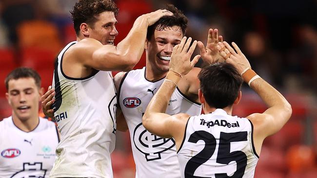 Jack Silvagni celebrates with Charlie Curnow and Zac Fisher after kicking a goal. Picture: Mark Kolbe/Getty Images