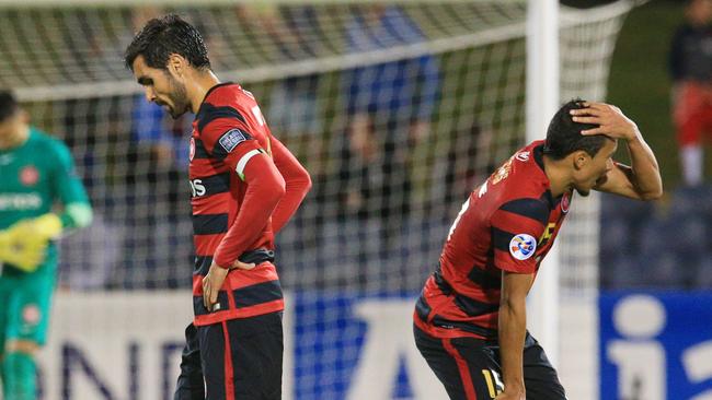 Dimas and Kearyn Baccus of the Wanderers react after the Western Sydney Wanderers loss to FC Seoul.