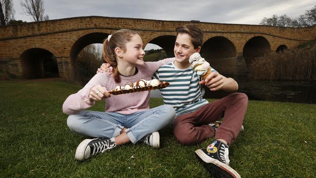 Twins Lucy and Flynn Preshaw, 12, eat ice cream from Sweets &amp; Treats in Richmond at the Richmond Bridge. Picture: Zak Simmonds