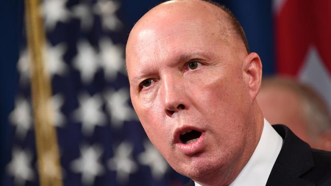 Peter Dutton defends the government over virus measures. Picture: AFP