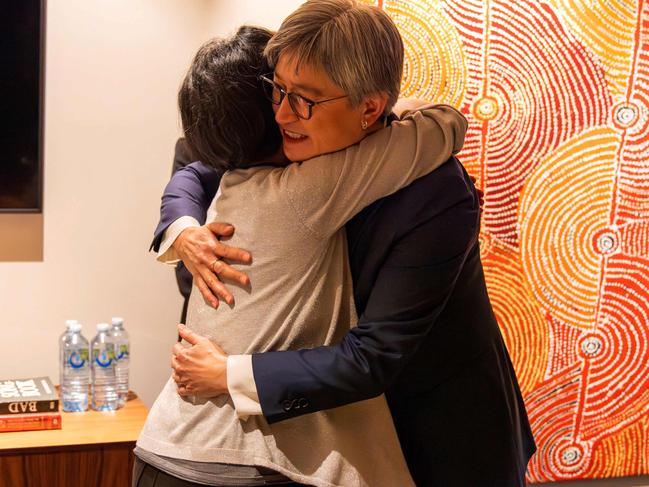 Welcome back home … Cheng Lei is hugged by Australian Foreign Minister Penny Wong upon her arrival at Melbourne airport.