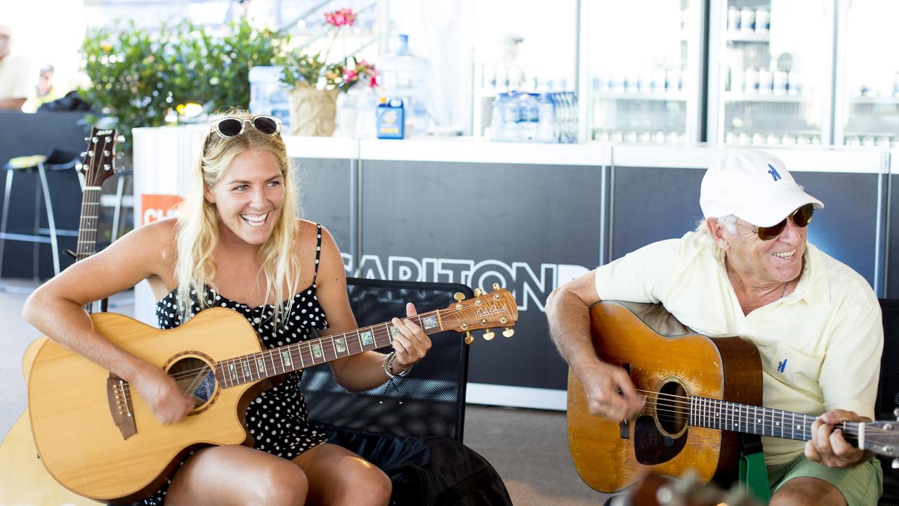 Stephanie Gilmore plays with the Jimmy Buffett Band at the Quiksilver Pro on the Gold Coast.