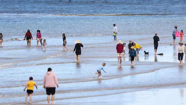 Families take to the beach at Torquay. Picture: Ian Currie