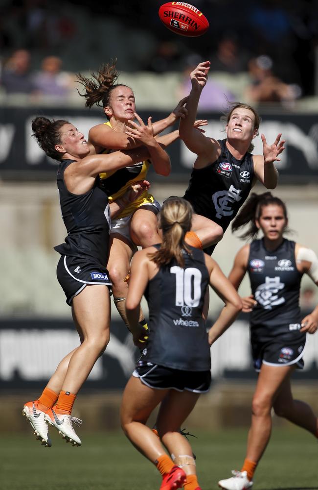 Blues Kerryn Harrington and Breann Moody fly against Richmond’s Gabrielle Seymour on Saturday. Picture: Dylan Burns/AFL Photos