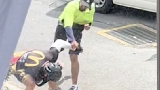 The postie jumped out of the van after the cyclist slammed the door into him. Picture: TikTok.