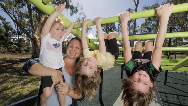 Everton Park mum of three Tegan Seccombe with daughters Hollie 2, Hannah 4, and Alicia 6 who will do an extra year of Kindy before they start school. Picture Lachie Millard