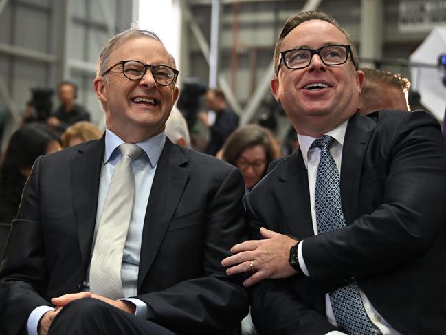 (lt-rt) Adam Goodes, Prime Minister Anthony Albanese and QANTAS CEO Alan Joyce as QANTAS unveil their Yes23 livery being carried on some of their aircraft at Sydney Domestic Airport in Sydney, Monday, August 14, 2023. (AAP Image/Dean Lewins) NO ARCHIVING