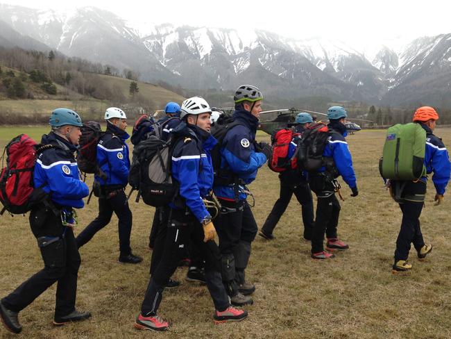 Gendarmerie and French mountain rescue teams arrive near the site of the Germanwings plane crash near the French Alps. Picture: Patrick Aventurier