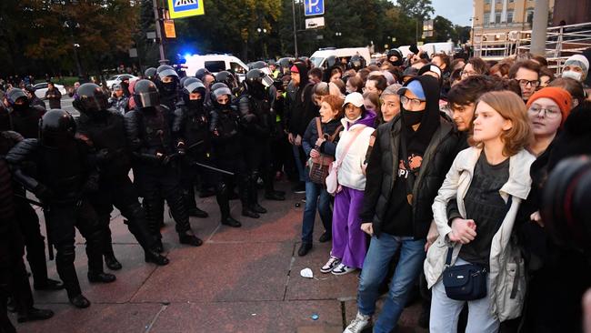 Police officers face off with demonstrators in tense scenes in Saint Petersburg on Wednesday. Picture: AFP