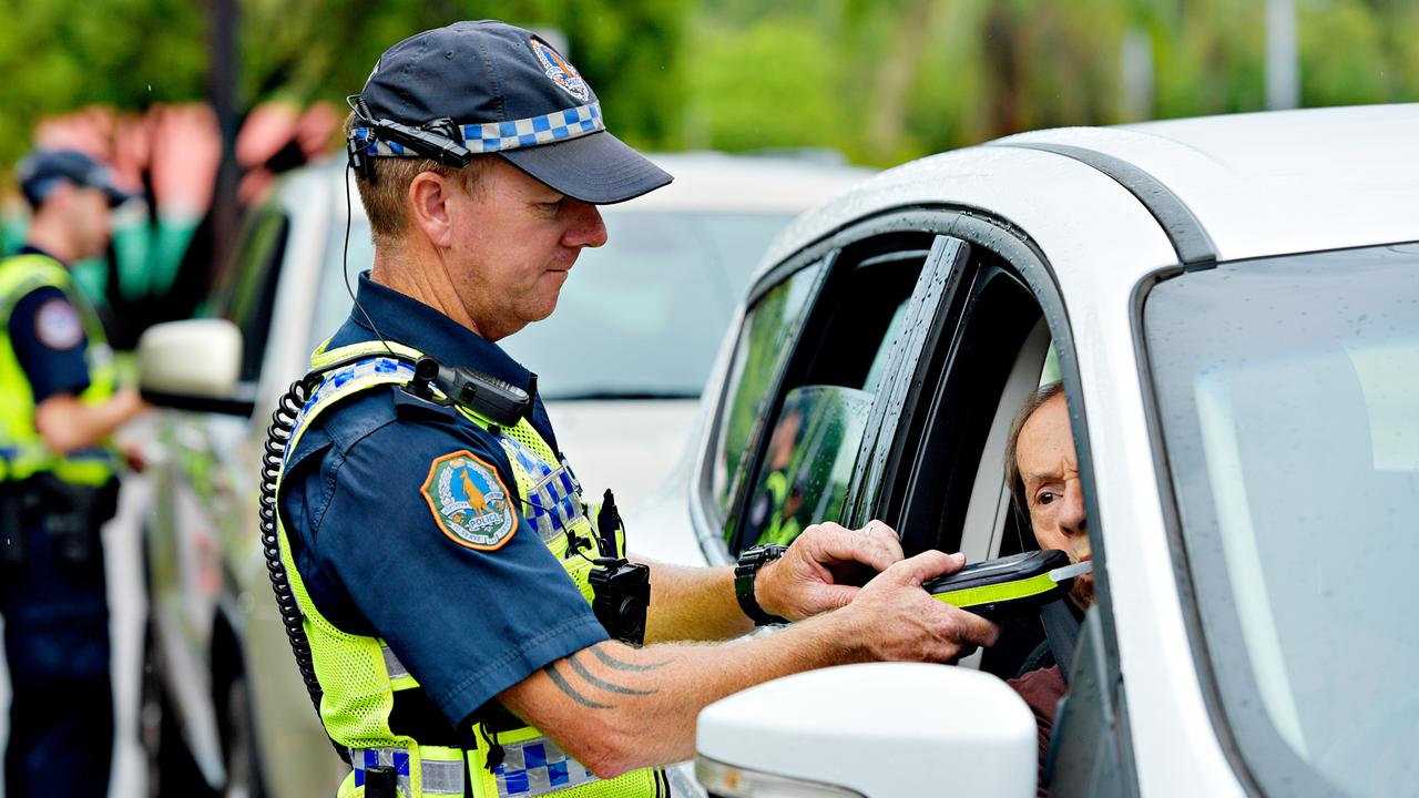 NT Police Acting Sergeant (A/Sgt) Clint Richardson tests a driver during a Roadside Breath Testing (RBT) station at Mindil Beach for Operation Sepio which will run over the Christmas period targeting drink driving and vehicle compliance.