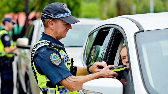 NT Police Acting Sergeant (A/Sgt) Clint Richardson tests a driver during a Roadside Breath Testing (RBT) station at Mindil Beach for Operation Sepio which will run over the Christmas period targeting drink driving and vehicle compliance.