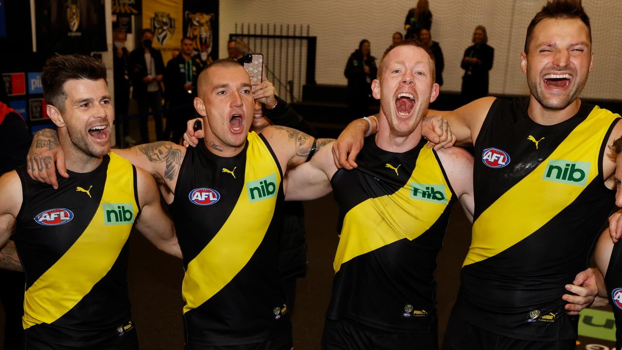 MELBOURNE, AUSTRALIA - MAY 07: (L-R) Trent Cotchin, Dustin Martin, Jack Riewoldt and Toby Nankervis of the Tigers sing the team song during the 2022 AFL Round 08 match between the Richmond Tigers and the Collingwood Magpies at the Melbourne Cricket Ground on May 07, 2022 in Melbourne, Australia. (Photo by Michael Willson/AFL Photos via Getty Images)