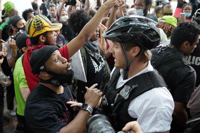 Demonstrators argue with uniformed US Secret Service police officers in Washington DC. Picture: AP