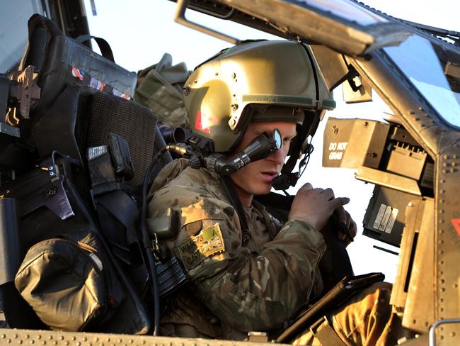 Prince Harry in the cockpit of an Apache helicopter in Afghanistan. He reveals he was asked where he would like to be buried. Picture: WPA Pool/Getty Images