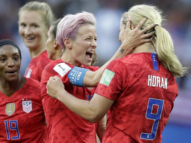 United States' scorer Lindsey Horan, right, celebrates their side's 3rd goal with Megan Rapinoe during the Women's World Cup Group F soccer match between United States and Thailand at the Stade Auguste-Delaune in Reims, France, Tuesday, June 11, 2019. (AP Photo/Alessandra Tarantino)