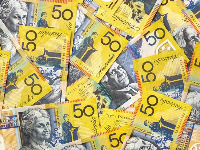 Background of Australian fifty dollar bills.  Full-frame. generic money, notes, cash.