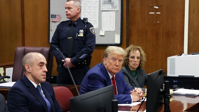 Donald Trump and lawyer Susan Necheles attend a hearing to determine the date of his trial for allegedly covering up hush money payments linked to extramarital affairs, at Manhattan Criminal Court in New York City during the week. Pictur: Spencer Platt / POOL / AFP