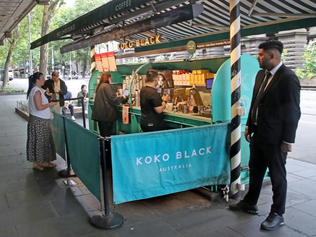 Koko Black coffee stand on Swanston St has a security guard.