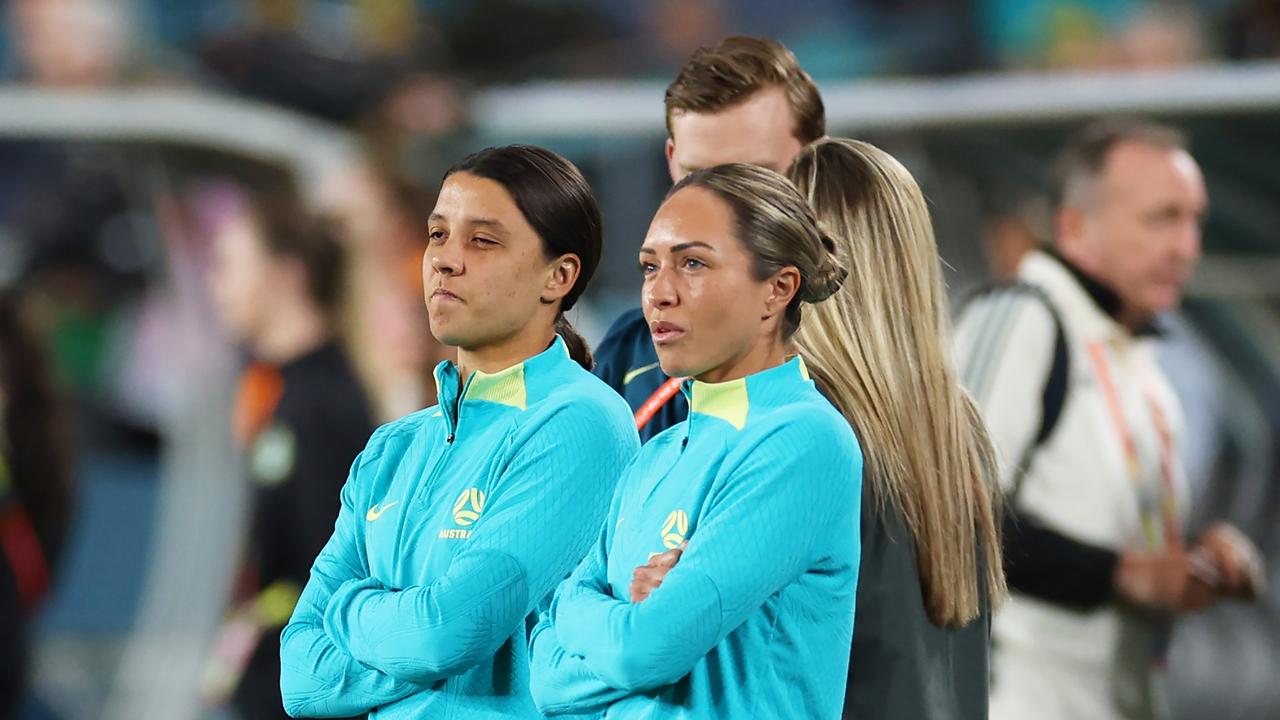 SYDNEY, AUSTRALIA - JULY 20: Sam Kerr (L) and Katrina Gorry (R) of Australia talk while her teammates inspect the pitch prior to the FIFA Women's World Cup Australia & New Zealand 2023 Group B match between Australia and Ireland at Stadium Australia on July 20, 2023 in Sydney, Australia. (Photo by Cameron Spencer/Getty Images)