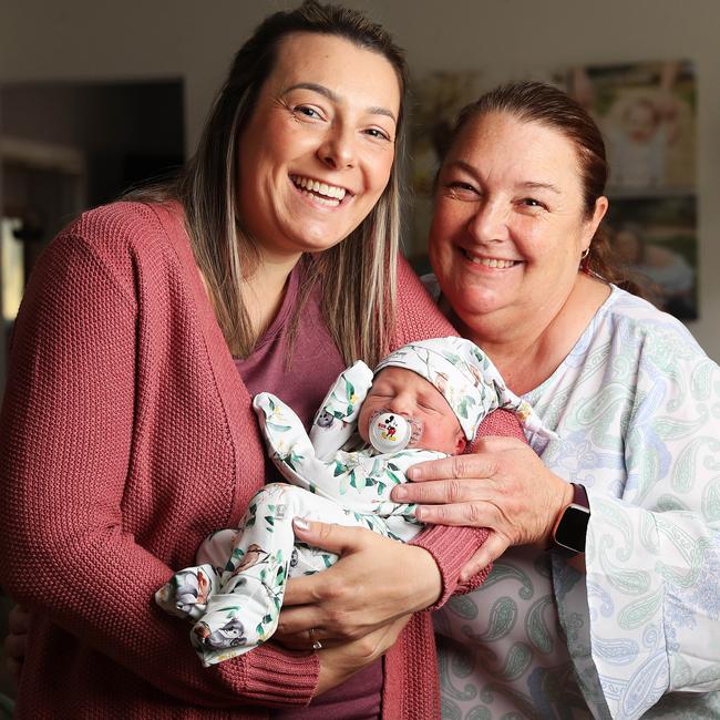 Chloe Hutt with baby Oliver and her mum Tracey Purcell who helped her deliver the baby with assistance from Ambulance Tasmania on the phone. Picture: Nikki Davis-Jones