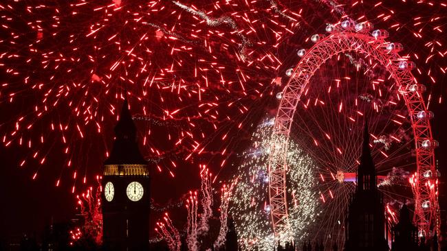 Fireworks explode in the sky around the London Eye and The Elizabeth Tower, commonly known by the name of the clock's bell, "Big Ben", at the Palace of Westminster, home to the Houses of Parliament, in central London. Picture: AFP