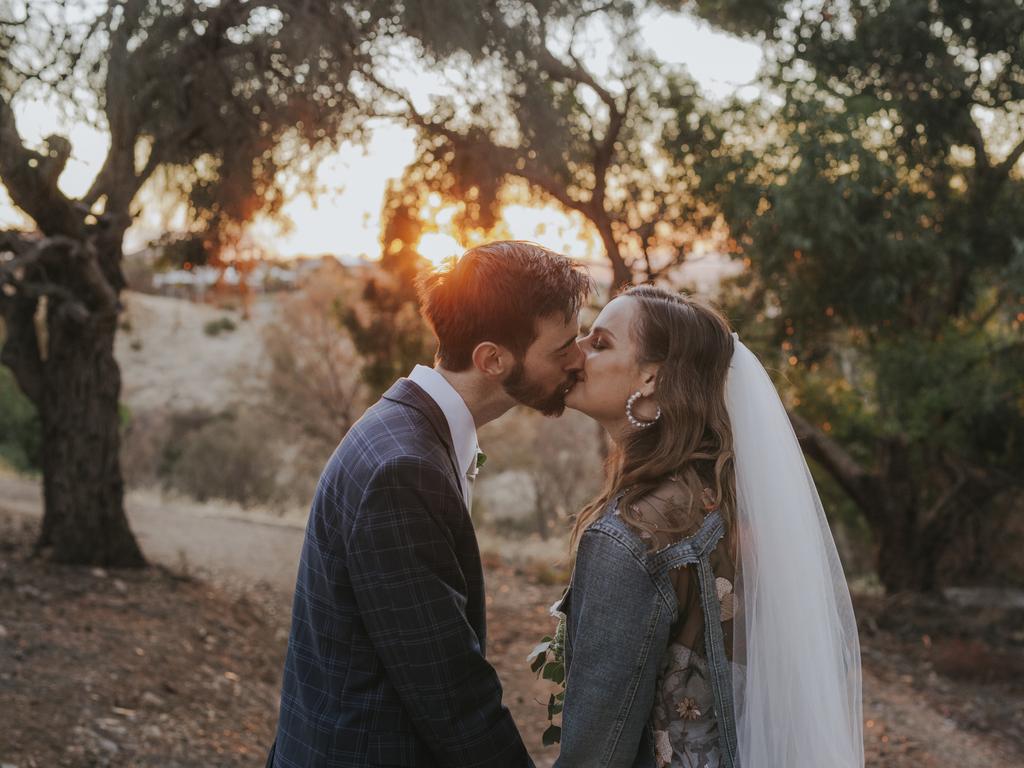 Sarah Wieszyk and Jack Hateley, married at the bride’s parents’ house, Wynn Vale, Two Tell a Tale photography. When restrictions changed, the moved their wedding to the very next day. While many of their original guests were unable to attend, it was a day full of “love, joy and tears”.