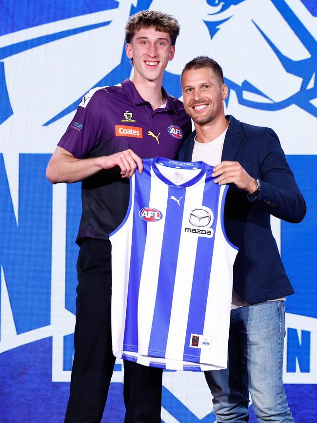 Matt Whitlock was presented with his North Melbourne jumper by Andrew Swallow. (Photo by Michael Willson/AFL Photos via Getty Images)