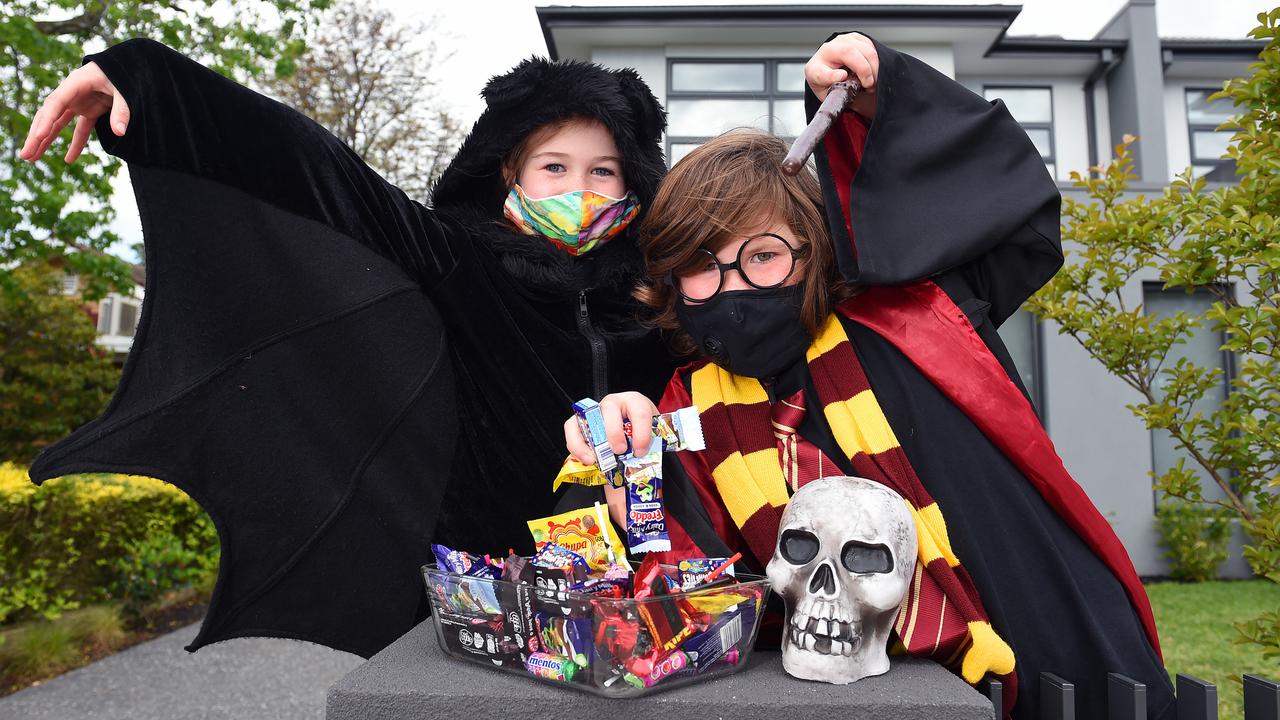 Kids need to wear masks this Halloween when trick-or-treating – and pre-wrapped lollies and chocolates are a must. Sophie Ashford, 9, and Jackson Lamb, 8. Picture: Josie Hayden