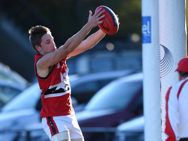 EFL (Division 3) footy. East Burwood v Park Orchards at East Burwood Reserve, East Burwood.  Park Orchards in red jumpers.  No 7 for Park Orchards Michael Prosenak allows the ball to go through for a point for Burwood. Picture: Lawrence Pinder