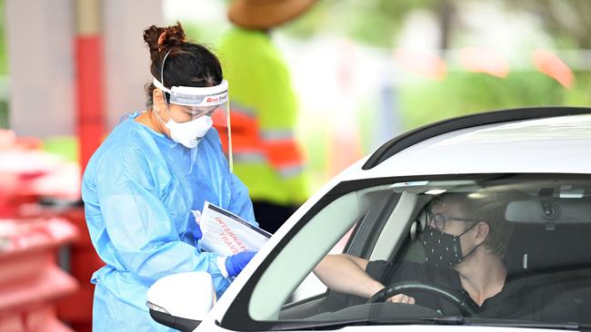 A health worker performs duties at a Covid-19 testing clinic in Brisbane.