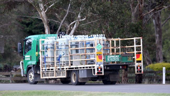 A truck load of gas bottle arrive at the farm