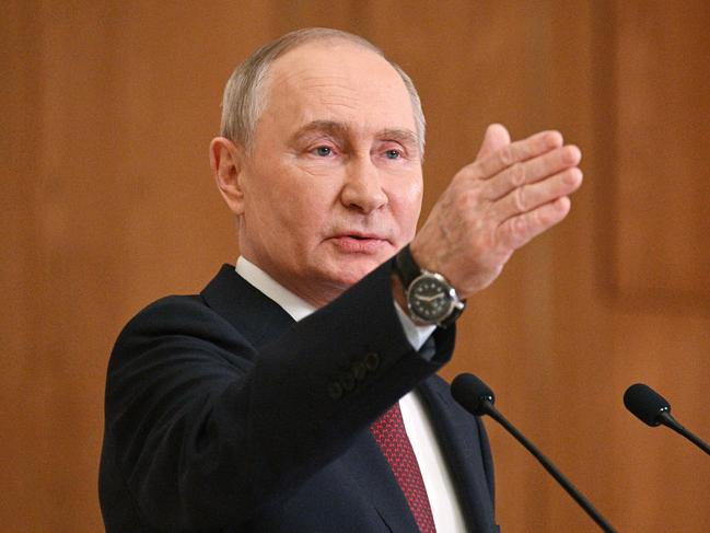 In this pool photograph distributed by the Russian state agency Sputnik, Russia's President Vladimir Putin gestures as he addresses the press after attending a meeting of the Collective Security Treaty Organization (CSTO) in Astana, on November 28, 2024. Russian President Vladimir Putin arrived in Kazakhstan on November 27, 2024, for a two-day trip aimed at shoring up ties with his Central Asian allies as tensions mount over the Ukraine war. Kazakhstan is a member of the Moscow-led CSTO security alliance but has expressed concern about the almost three-year conflict, which Kazakh President Kassym-Jomart Tokayev has refused to condone. (Photo by Ramil SITDIKOV / POOL / AFP)