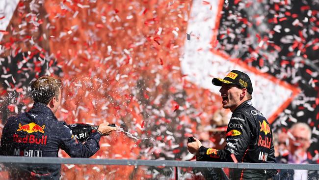 Race winner Max Verstappen celebrates on the podium