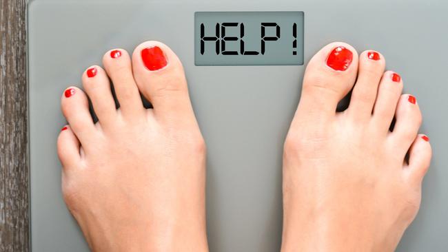 Lose weight concept with person on a scale measuring kilograms